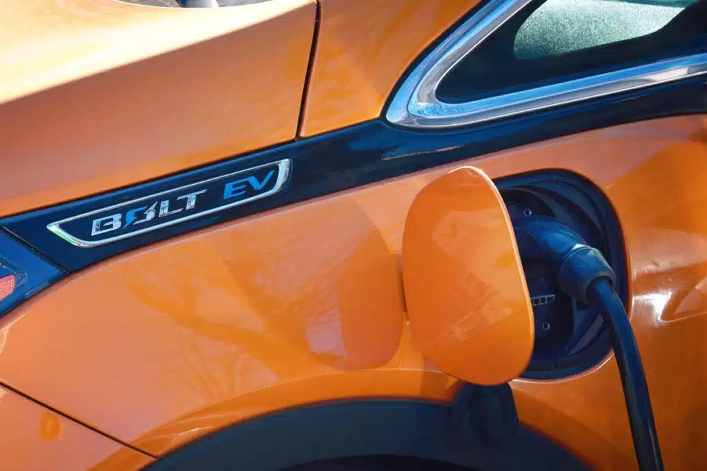Close up of a Chevy Bolt charging, representing the Chevy Bolt settlement.