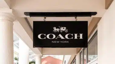 Close up of Coach store signage, representing the Coach Outlet class action.