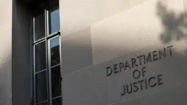U.S. Department of Justice headquarters signage, representing the U.S. Victims of State Sponsored Terrorism Fund to victims.
