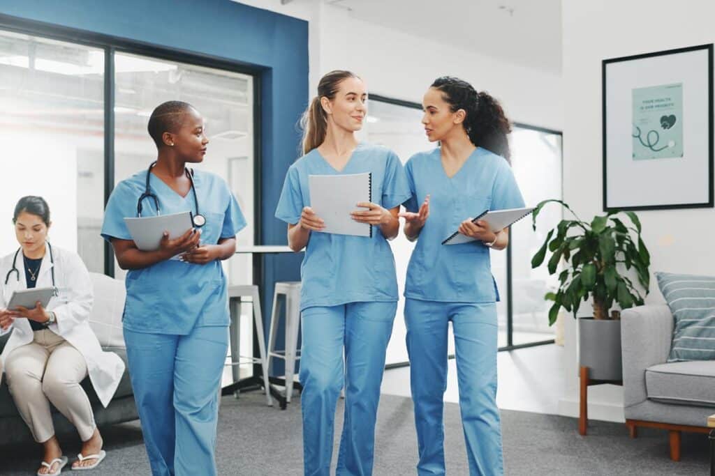 Nurses walking in a hospital, representing the Stanford Health Care settlement.