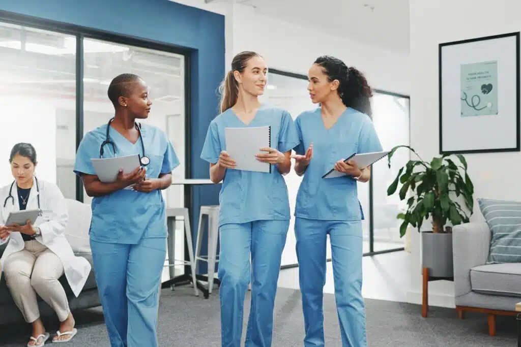 Nurses walking in a hospital, representing the Stanford Health Care settlement.