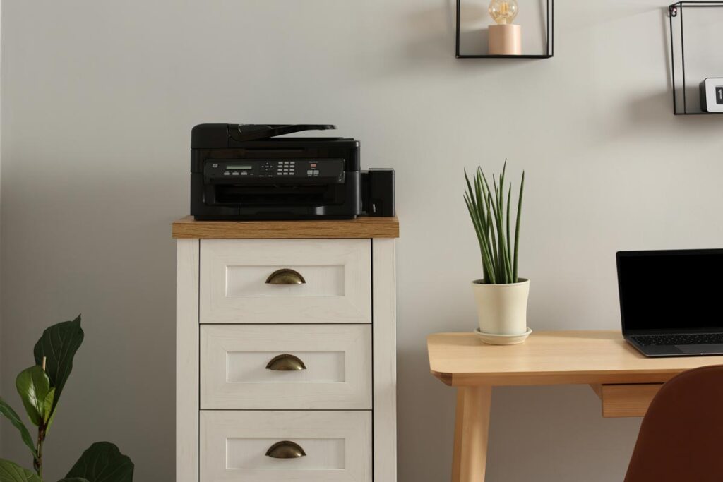 A printer on top of furniture, representing the household products recalls and lawsuits.