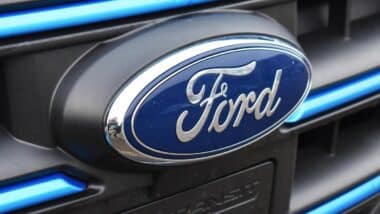 Close up of Ford emblem on a front bumper, representing the Ford recall.