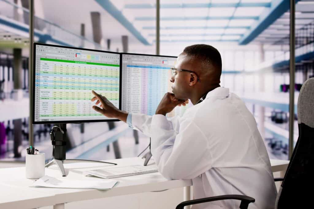 A doctor using a computer, representing the Hapy Bear Surgery Center settlement.