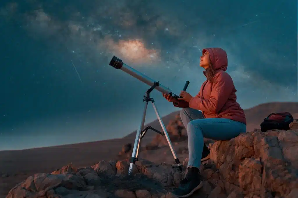 A woman using a telescope, representing the Telescope antitrust settlement.