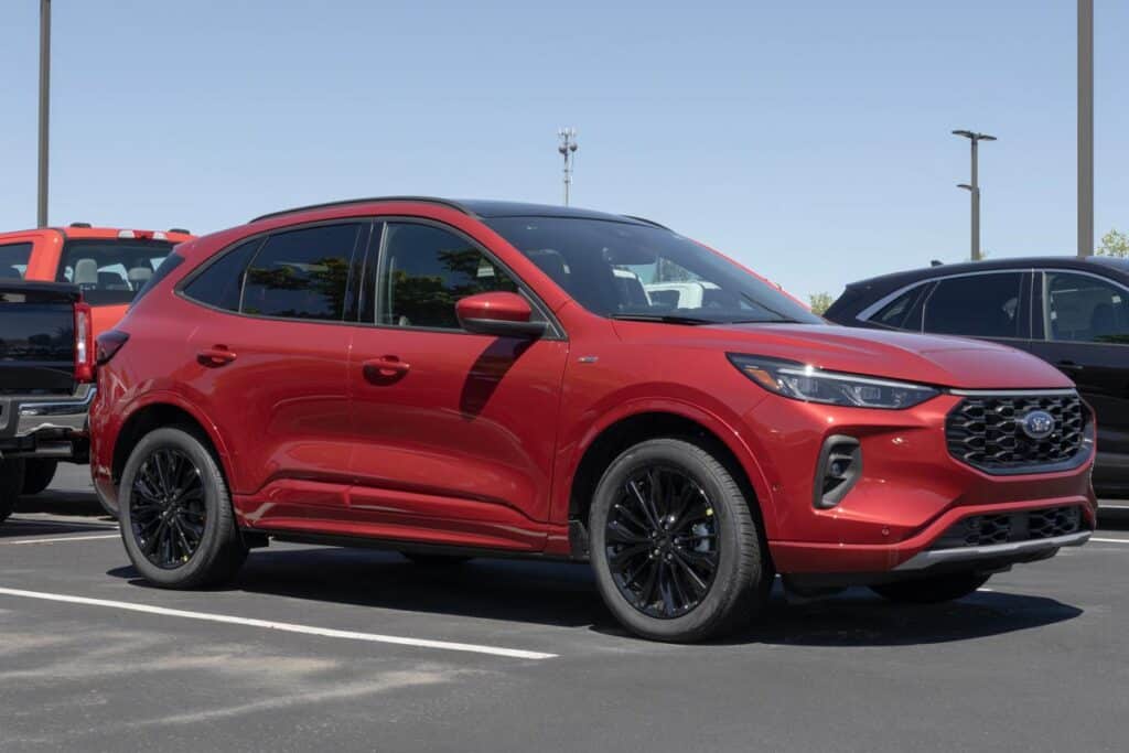 A red 2024 Ford Escape in a parking lot, representing the Ford Escape and Lincoln Corsair recall.