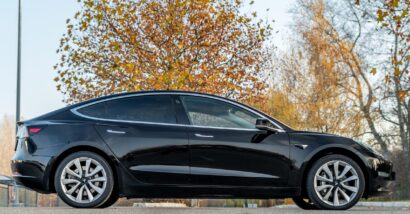 A black Tesla, representing the Tesla Actually Smart Summon feature.