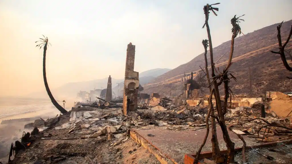 The Palisades fire burns fiercely during a powerful windstorm, spreading devastation across the west side of Los Angeles, California.