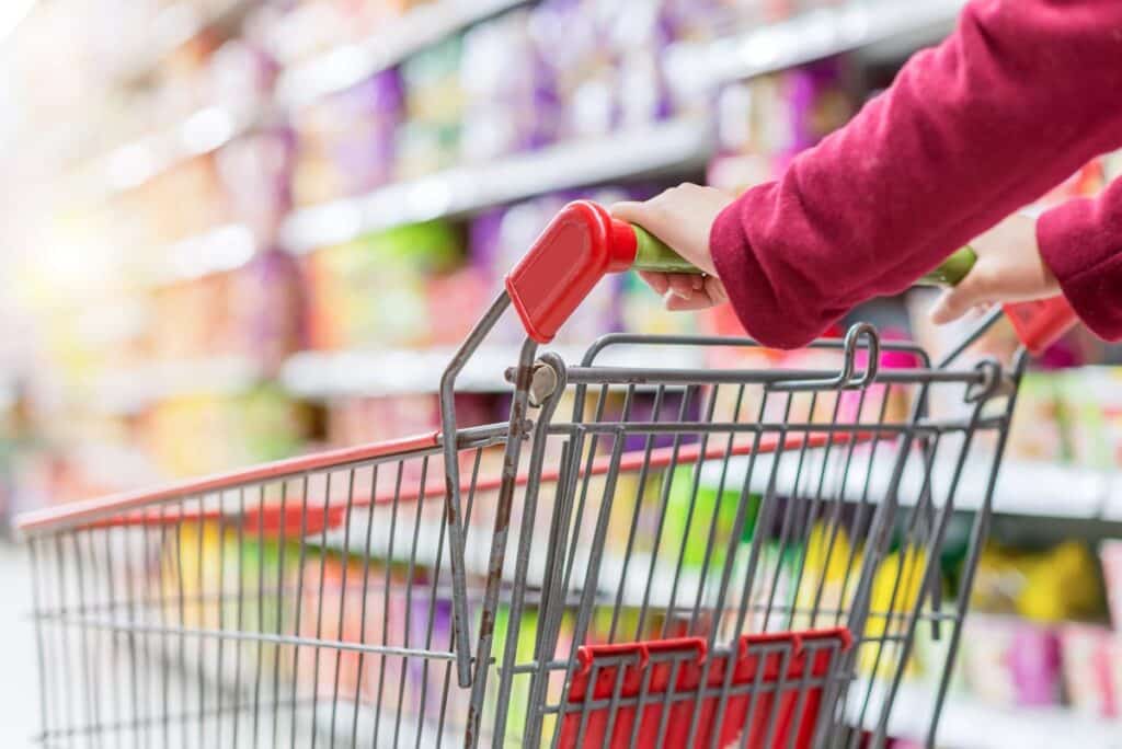 Close up of a woman pushing a shopping cart, representing top recalls for the week of Jan. 13.