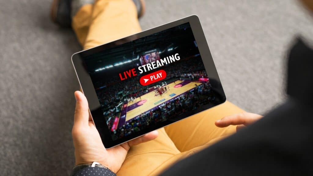 Man watching sports on live streaming online service.