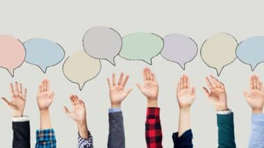 Hands raised with speech bubble