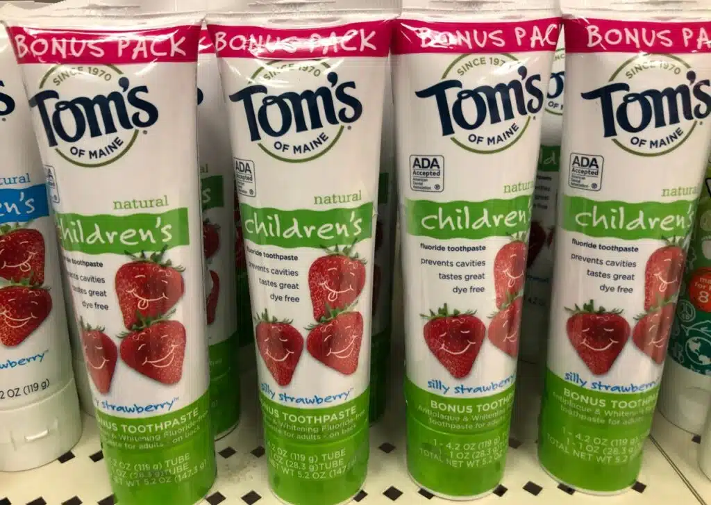 Tom's of Maine Children's toothpaste on sale at a grocery store retailer shelf. Silly strawberry flavor.