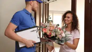 An employee delivering a floral arrangement,representing the FTD class action.