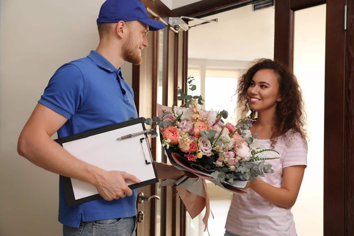 An employee delivering a floral arrangement,representing the FTD class action.