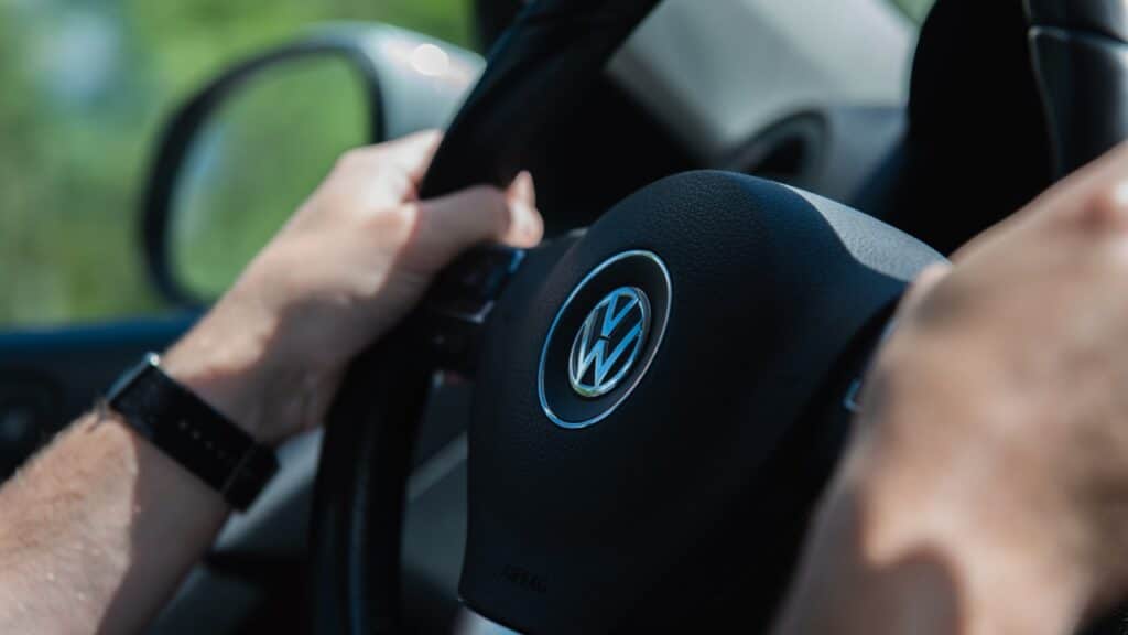 closeup shot of a man driving Volkswagen Tiguan.