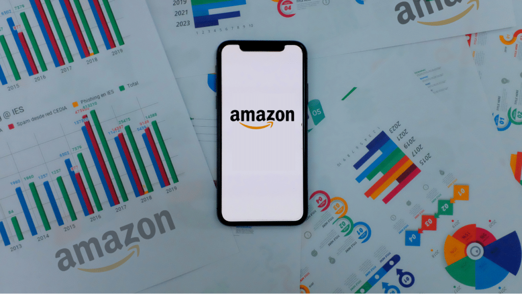 Iphone 11 pro with the Amazon logo. on top of charts