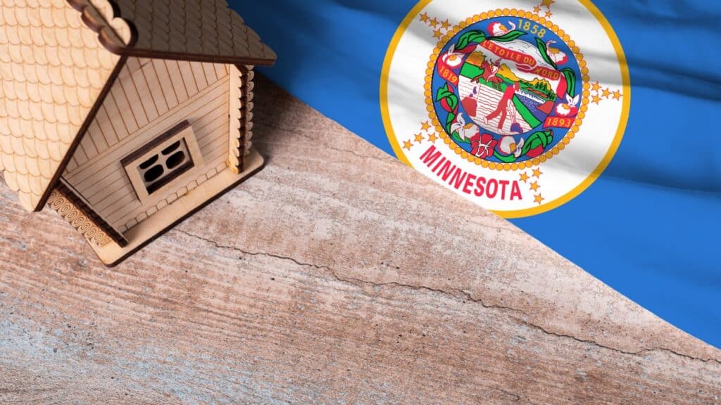House model near Minnesota flag