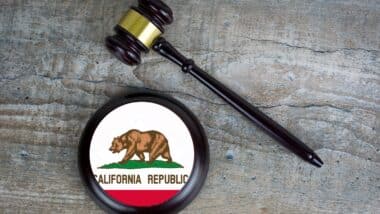 Wooden judgement or auction mallet with of California flag.