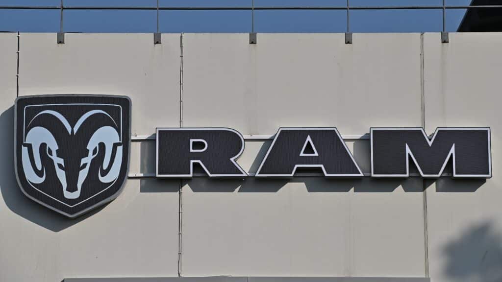 A wall sign for the American truck brand Ram at a car dealership