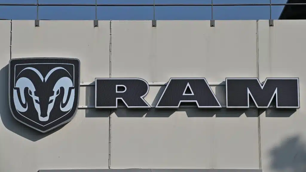A wall sign for the American truck brand Ram at a car dealership