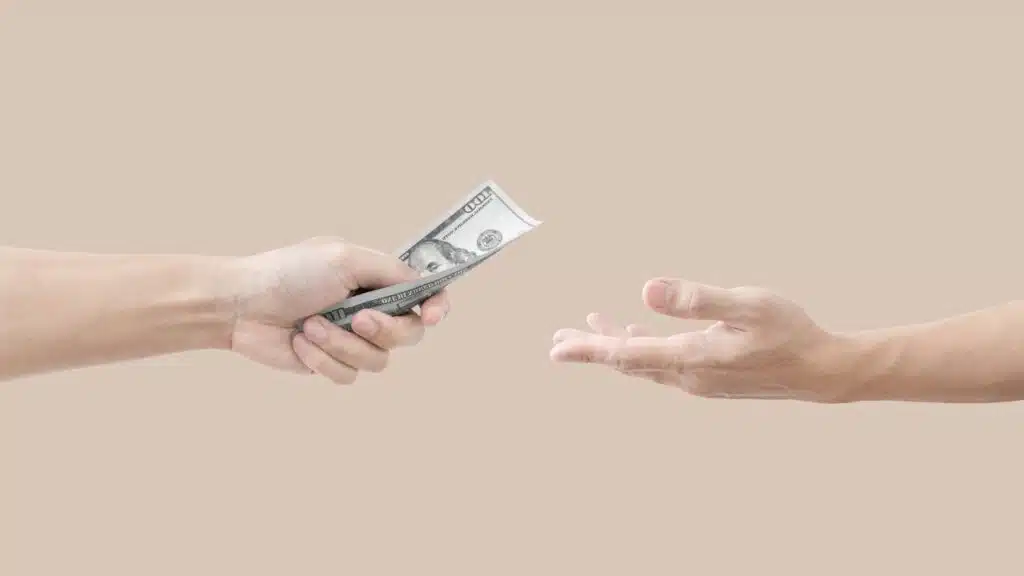 Hands giving and receiving money