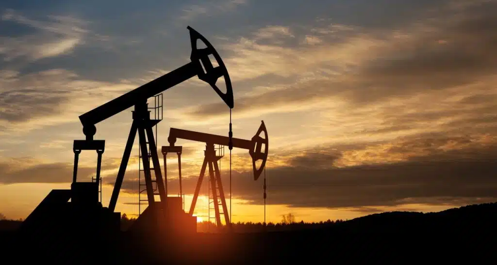 Oil drilling derricks at desert oilfield.