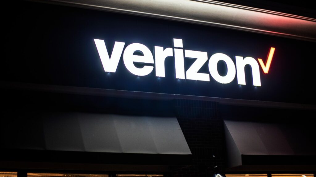 Verizon retail store exterior building sign at night
