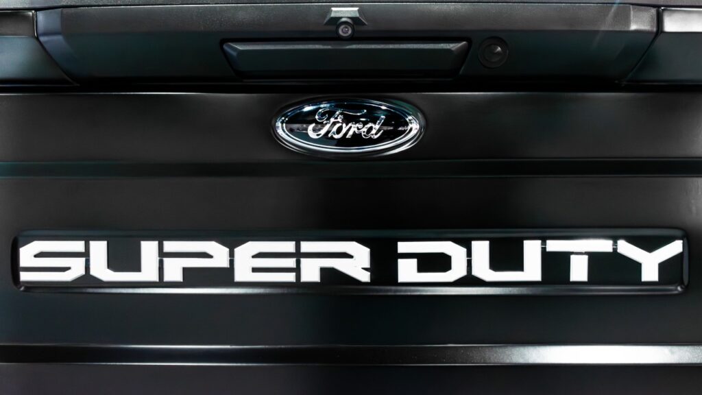 Close up logo Ford and message SUPER DUTY on tailboard