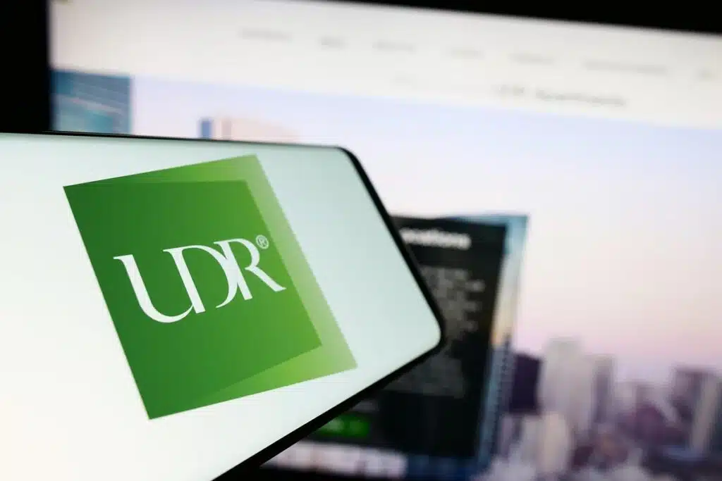 UDR logo displayed on a smartphone screen, representing the United Dominion Realty settlement.
