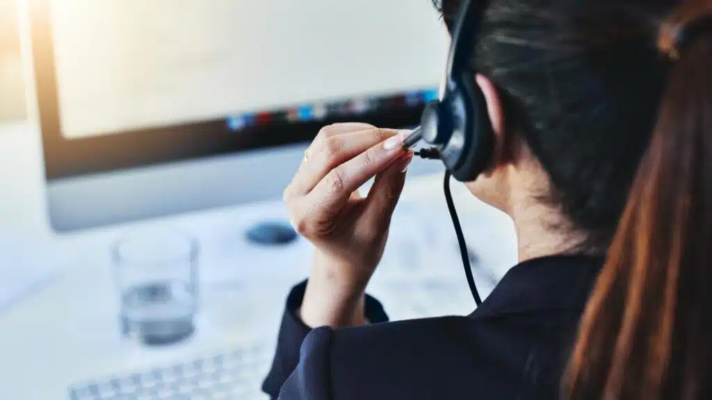 Telemarketing Woman in headset at call center.
