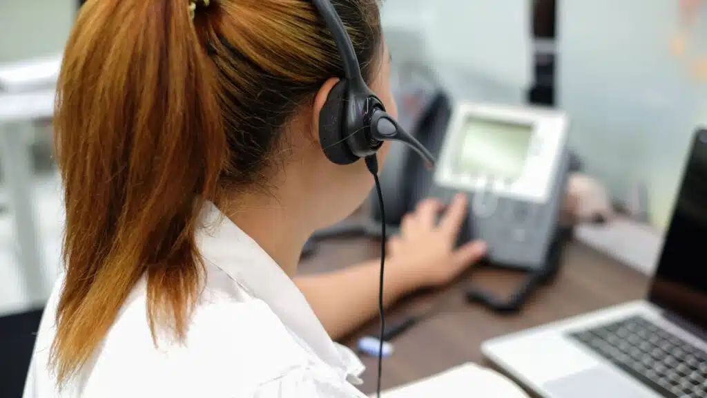 close up focus on headphone of a call centre person
