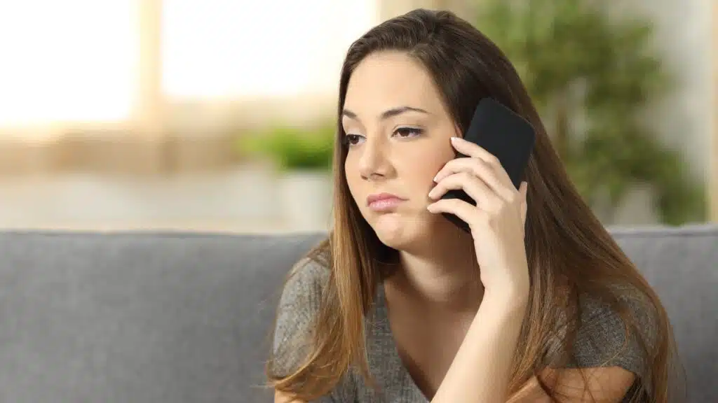 woman fielding another telemarketing call.