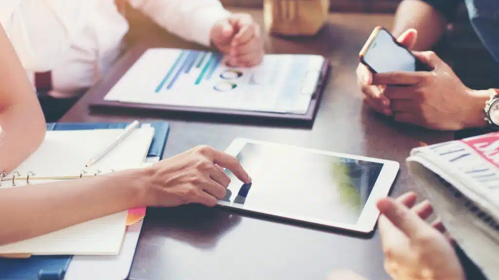 Business team discusses marketing plans or strategic plans in the meeting room.
