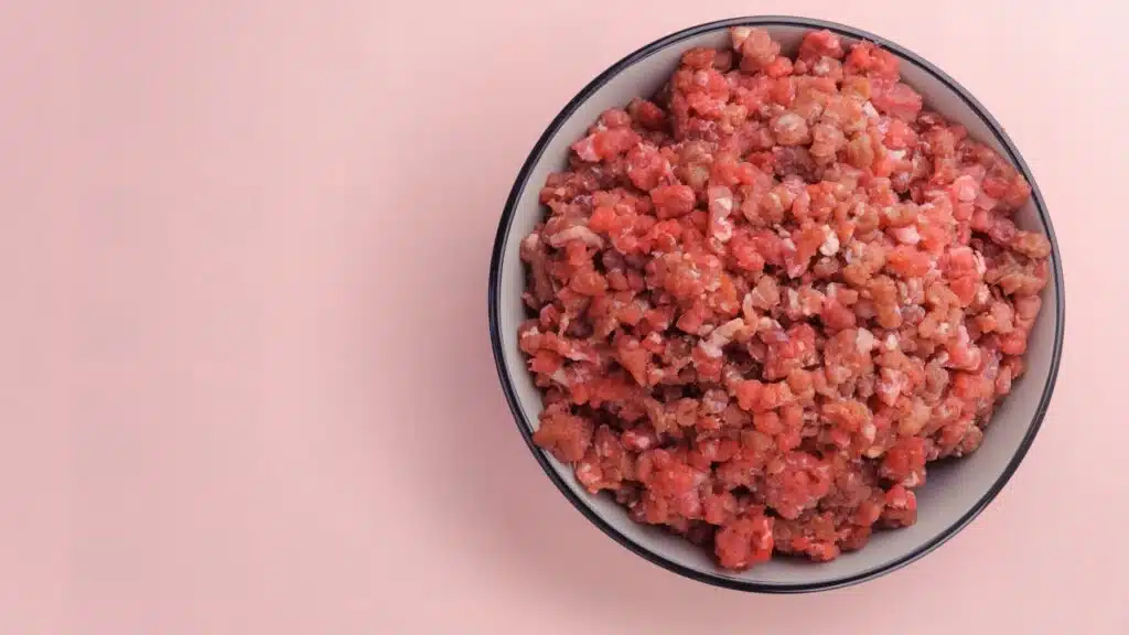 Natural raw ingredients for pet food on pink background