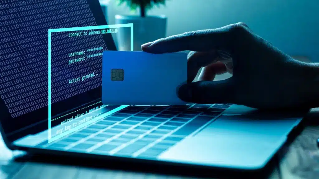 The concept of credit card theft. Hackers with credit cards on laptops use these data for unauthorized shopping. 