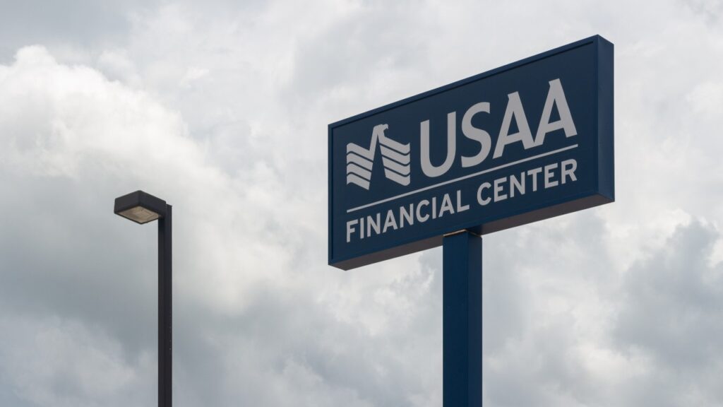 A USAA Financial Center sign sits high in the sky, attracting customers to their banking and insurance services.