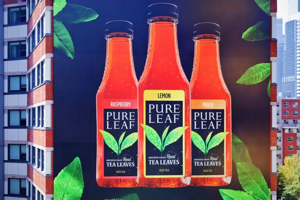 Pure Leaf brewed iced tea advertisement on building exterior wall