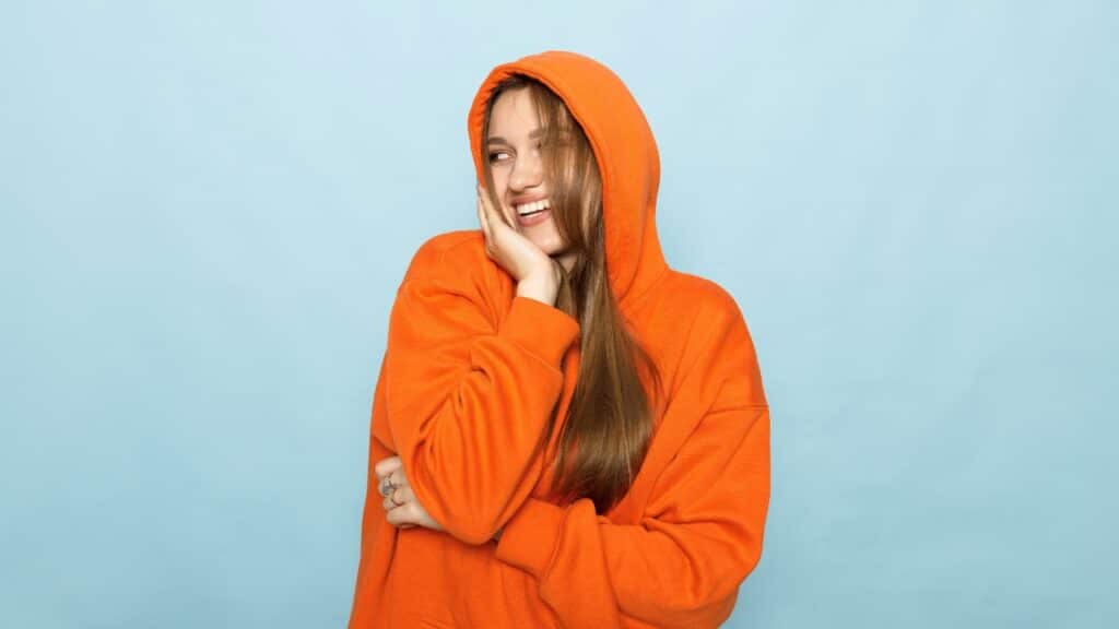 Woman in sweatshirt representing Comfrt class action lawsuit