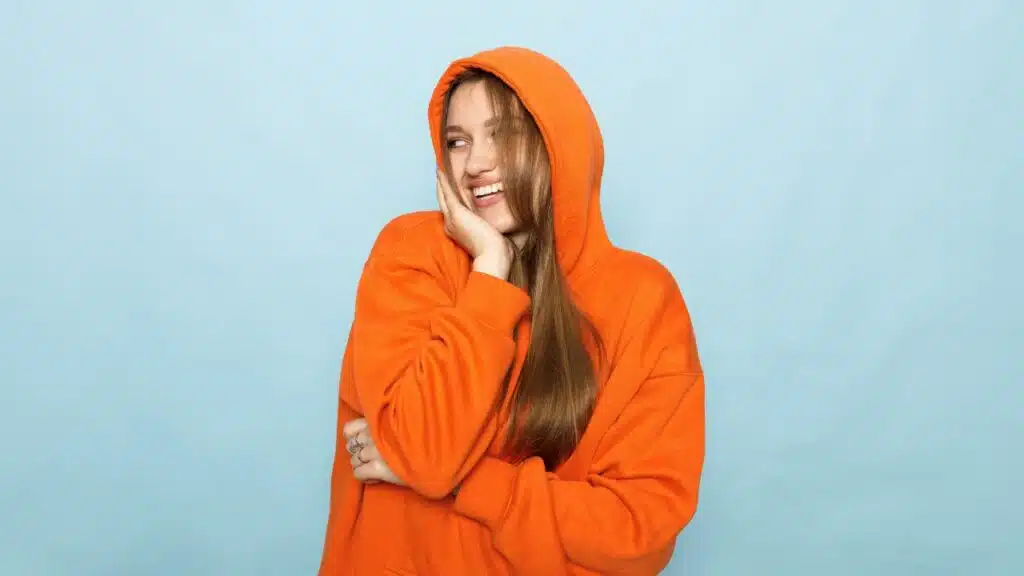 Woman in sweatshirt representing Comfrt class action lawsuit