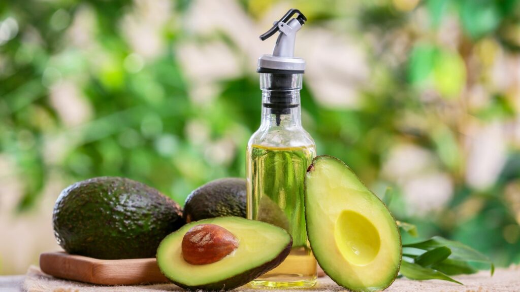 Bottle of avocado oil on table outdoors