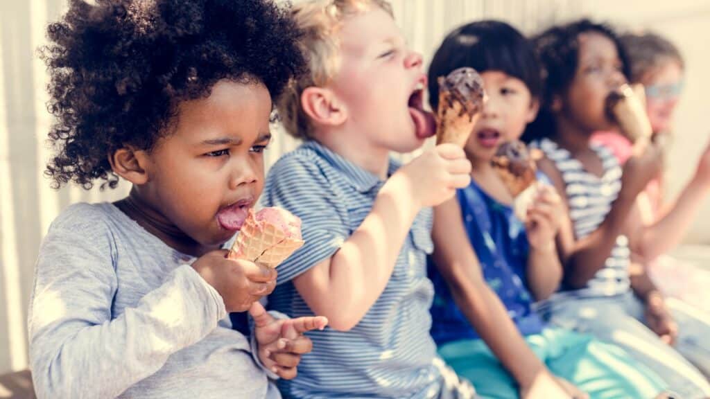 Kids eating ice cream in the summer