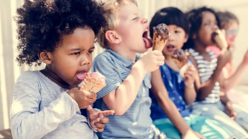 Kids eating ice cream in the summer