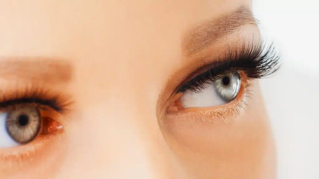 Female eyes with extreme long false eyelashes. Eyelash extensions, make-up, cosmetics, beauty.