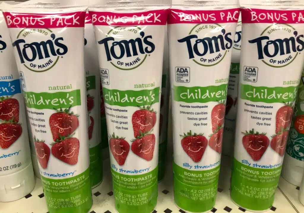 Tom's of Maine Children's toothpaste on sale at a grocery store retailer shelf. Silly strawberry flavor