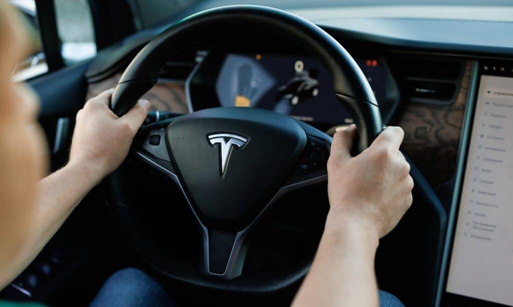 Tesla model X driving.