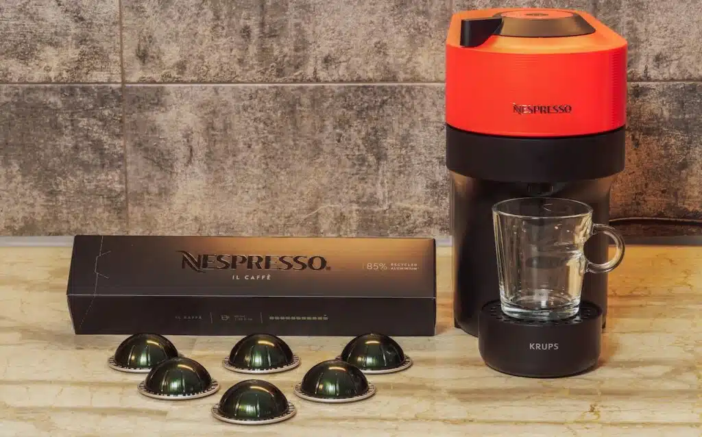 Automatic Nespresso Vertuo Pop machine used to create espresso with aluminum capsules.