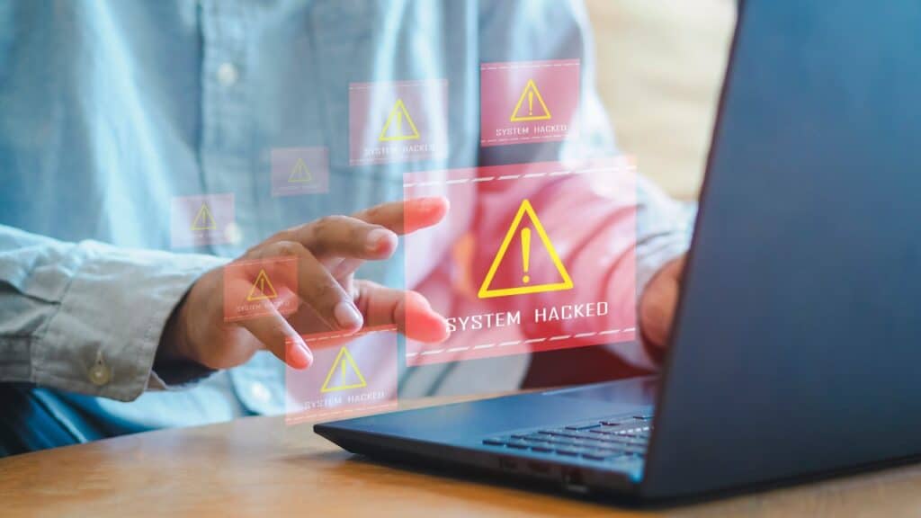 System hacked alert after cyber attack on computer network.