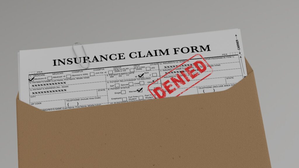Document with denied stamp put on the wooden table