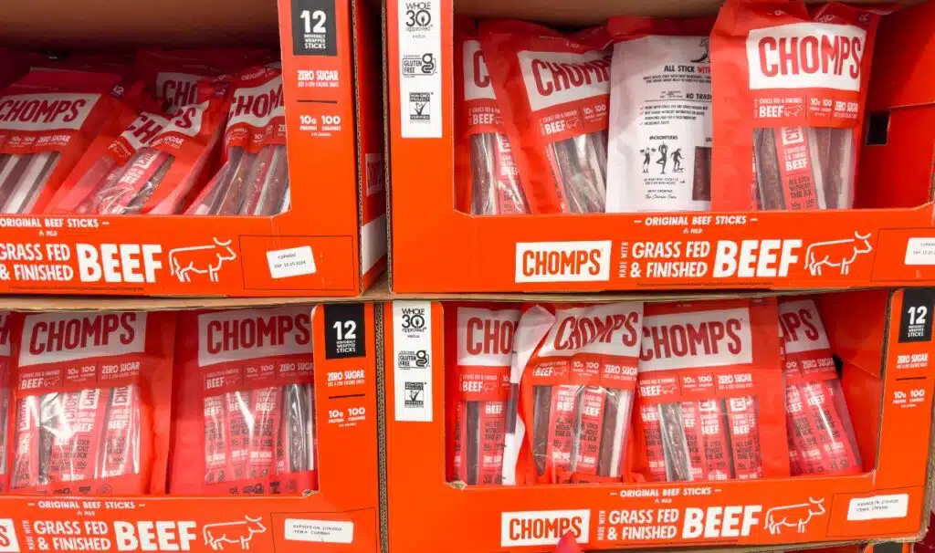 A view of several packages of Chomps beef sticks, on display at a local grocery store.