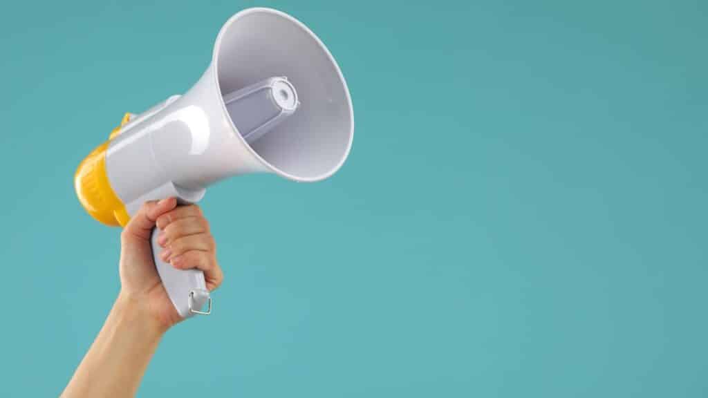 Woman holding megaphone speaker
